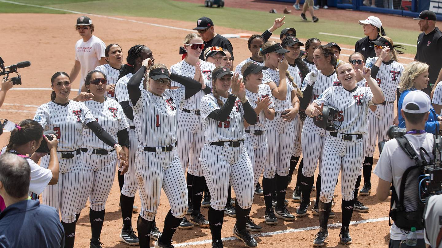 May 28, 2026; Oklahoma City, OK, USA; Texas Tech Red Raiders celebrate after run ruling the Mississippi State Bulldogs in the fifth inning during the NCAA Women’s College World Series at Devon Park. Texas Tech won 8-0. Mandatory Credit: Brett Rojo-Imagn Images