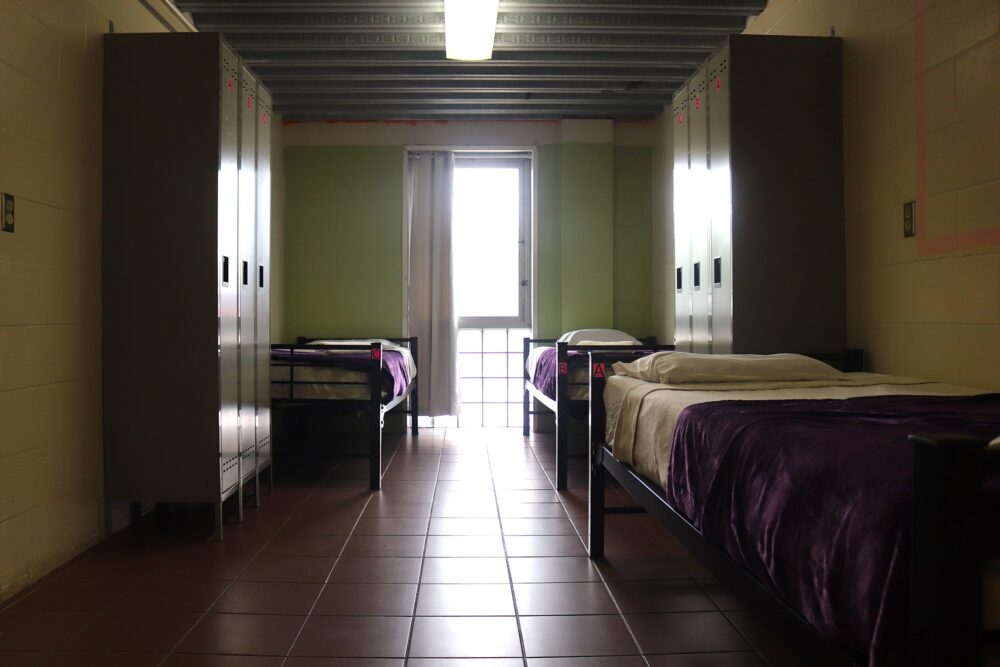 Each room at 419 Emancipation Avenue contains three beds and a set of lockers.