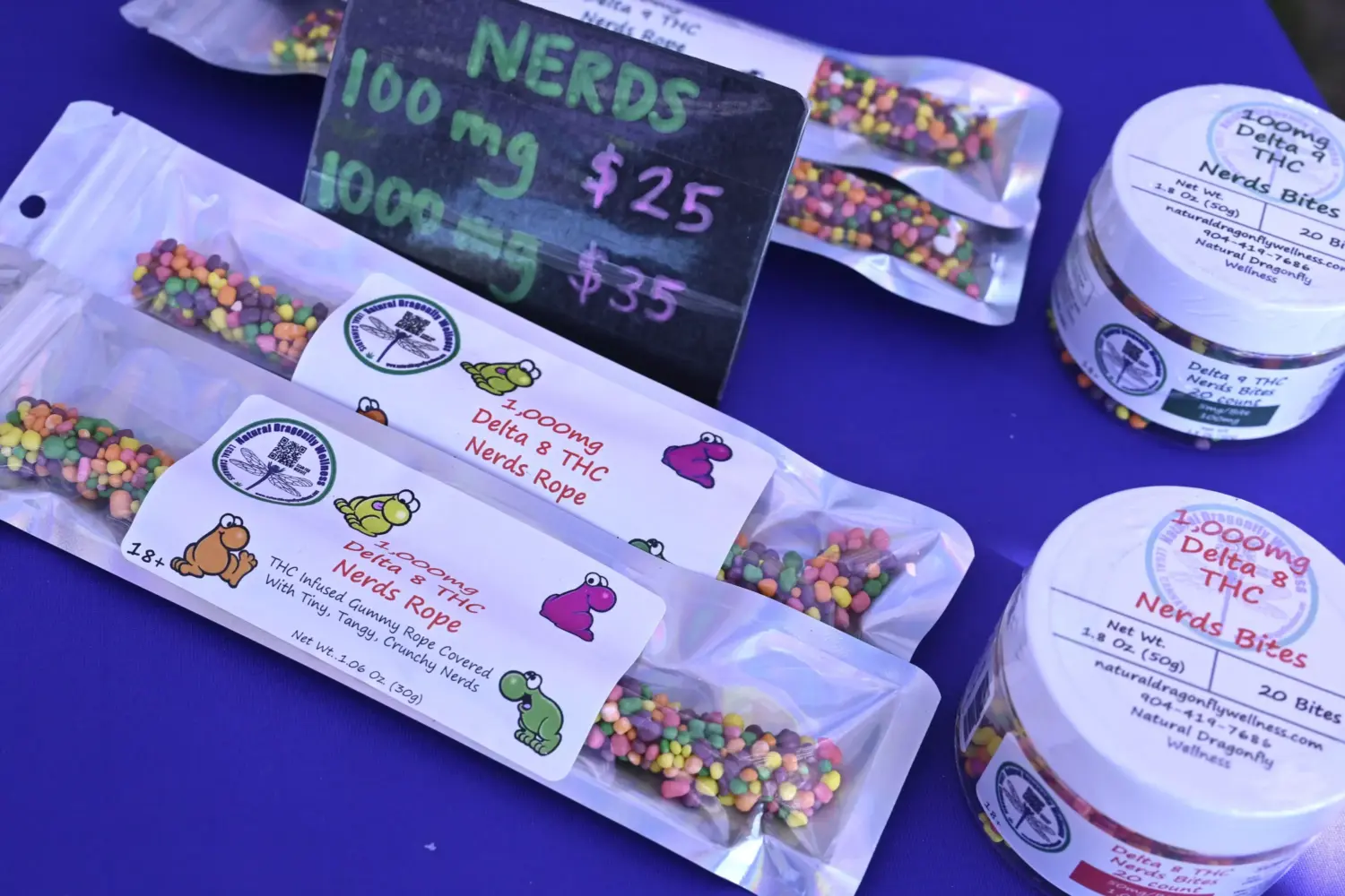 Delta 8 THC Nerds Rope gummies and Delta 8 THC Nerds Bites, legal cannabis products sold by Natural Dragonfly Wellness, are viewed at their booth during the Florida Man Games, Saturday, March 1, 2025, in Elkton, Fla.