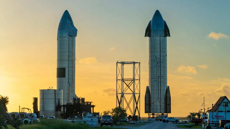 Starbase, Texas and surrounding buildings, with two Starship rockets in the background