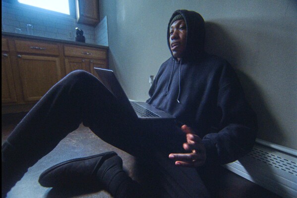 This image released by Paramount+ shows Kemba in a scene from the documentary "As We Speak: Rap Music on Trial." (Paramount+ via AP)