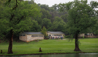 State lawmakers serving on a joint general investigating committee examining the July 2025 flooding walk the grounds of Camp Mystic in Hunt, Texas, on April 20.