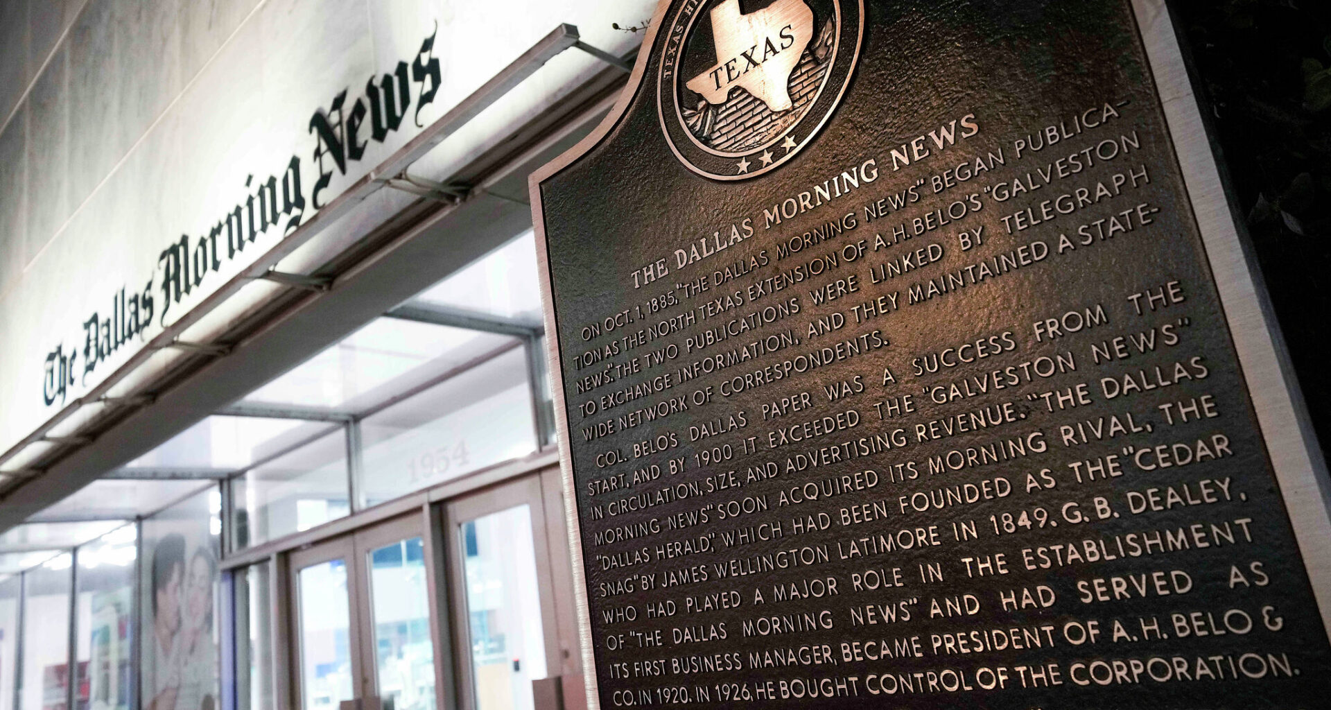 A historical marker is seen near the front entrance to the offices of The Dallas Morning News at 1954 Commerce Street in Dallas on Monday, Sept. 22, 2025.