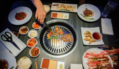 A spread of dishes and the tabletop grill at Gen Korean BBQ House.