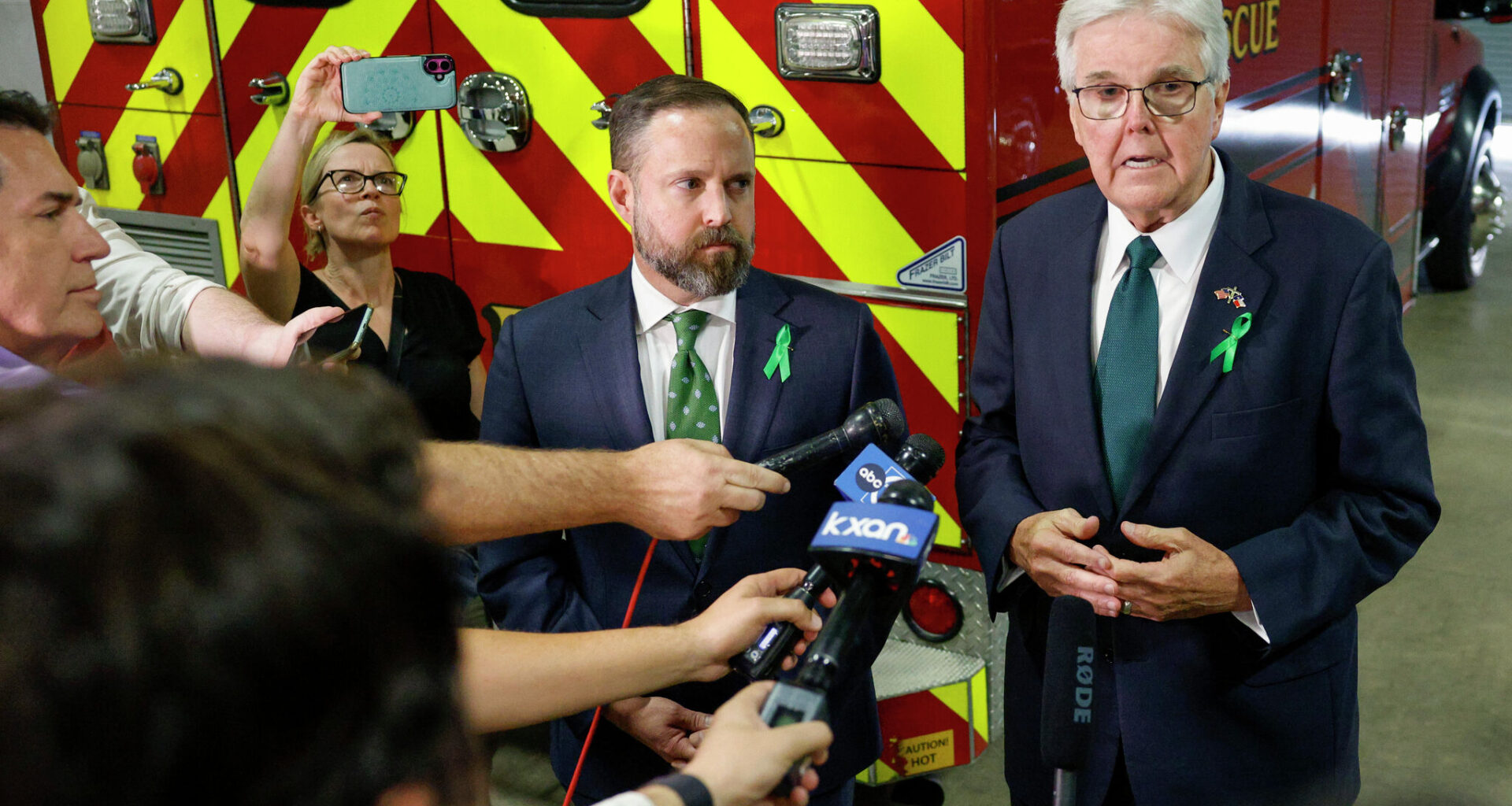 Lt. Gov. Dan Patrick (right) speaks to reporters alongside House Speaker Dustin Burrows, R-Lubbock, outside a joint hearing of the Texas Senate and House Select Committees on disaster preparedness and flooding, Thursday, July 31, 2025, in Kerrville, Texas.