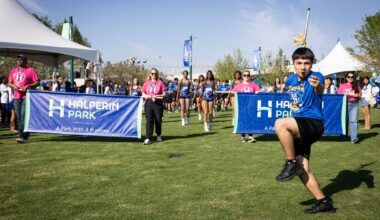 The Townview marching band parade across the lawn during opening celebration for Halperin Park, Oak Cliff’s new deck park in Dallas, Saturday, May 9, 2026. The band shell is seen in the background.