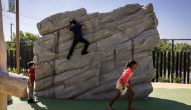 Esperanza Chambers runs off while Noah Gutierrez, 5, watches brother Nicolas Gutierrez, 9, climb a wall at Halperin Park during the opening celebration of Oak Cliff’s new deck park in Dallas, Saturday, May 9, 2026.