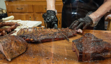 Pork ribs are sliced with an electric knife at Snow's BBQ on July 31, 2021 in Lexington, Texas.