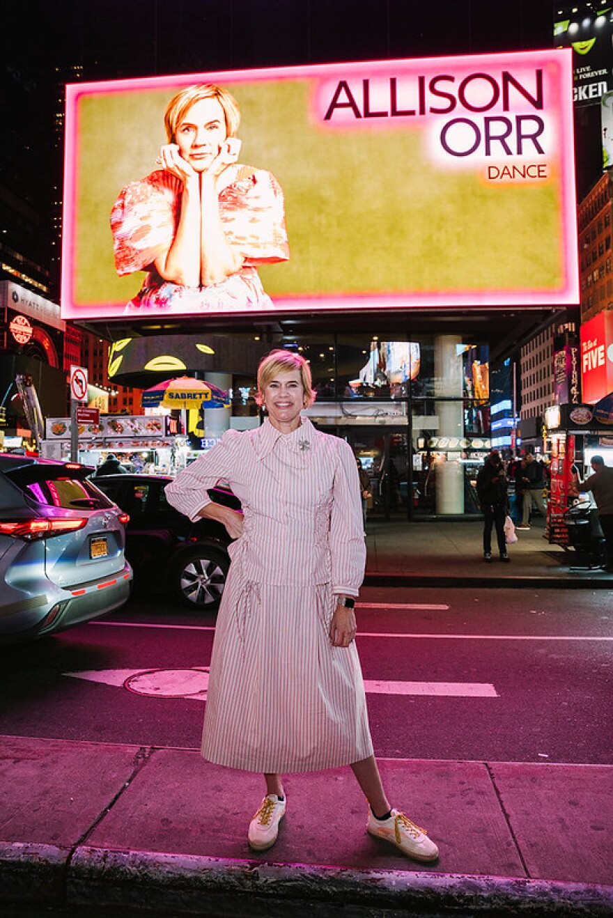 Allison Orr poses in front of Times Square photo by Jonica Moore