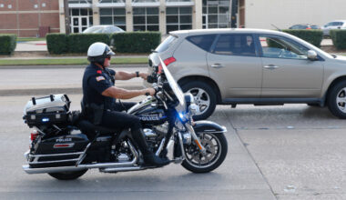 Garland police Officer Lanny Orman chases a motorist for texting on his phone while driving through a school zone at Handley Elementary.