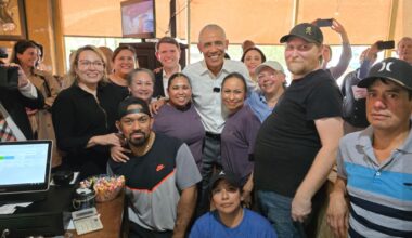 Former U.S. President Barack Obama alongside Texas Democrats James Talarico and Gino Hinojosa pose for a photo with Taco Joint staff in Austin, Texas.