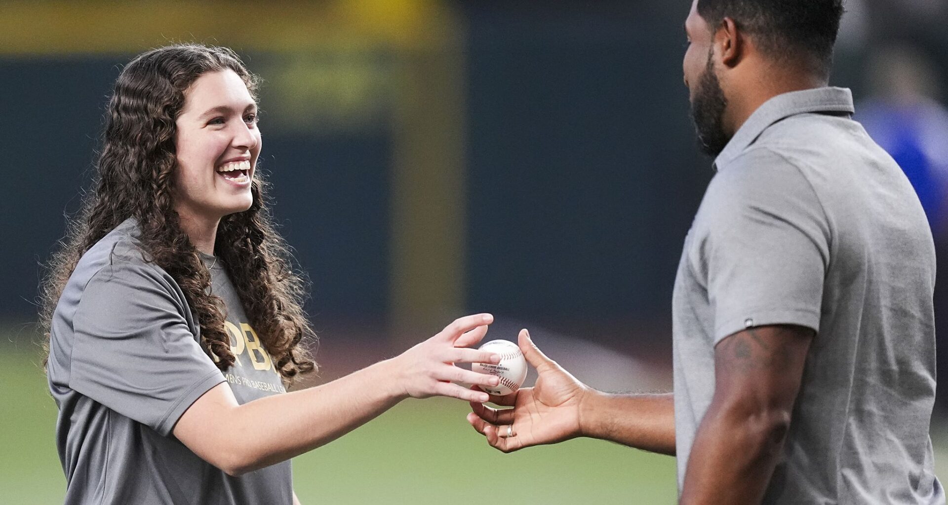 Arlington High's Abigail Moore throws Rangers' ceremonial first pitch