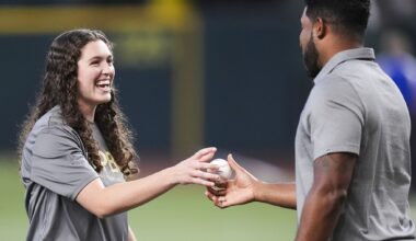 Arlington High's Abigail Moore throws Rangers' ceremonial first pitch