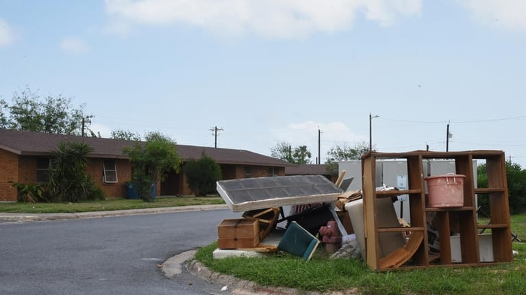 A pile of furniture is seen in a public housing...
