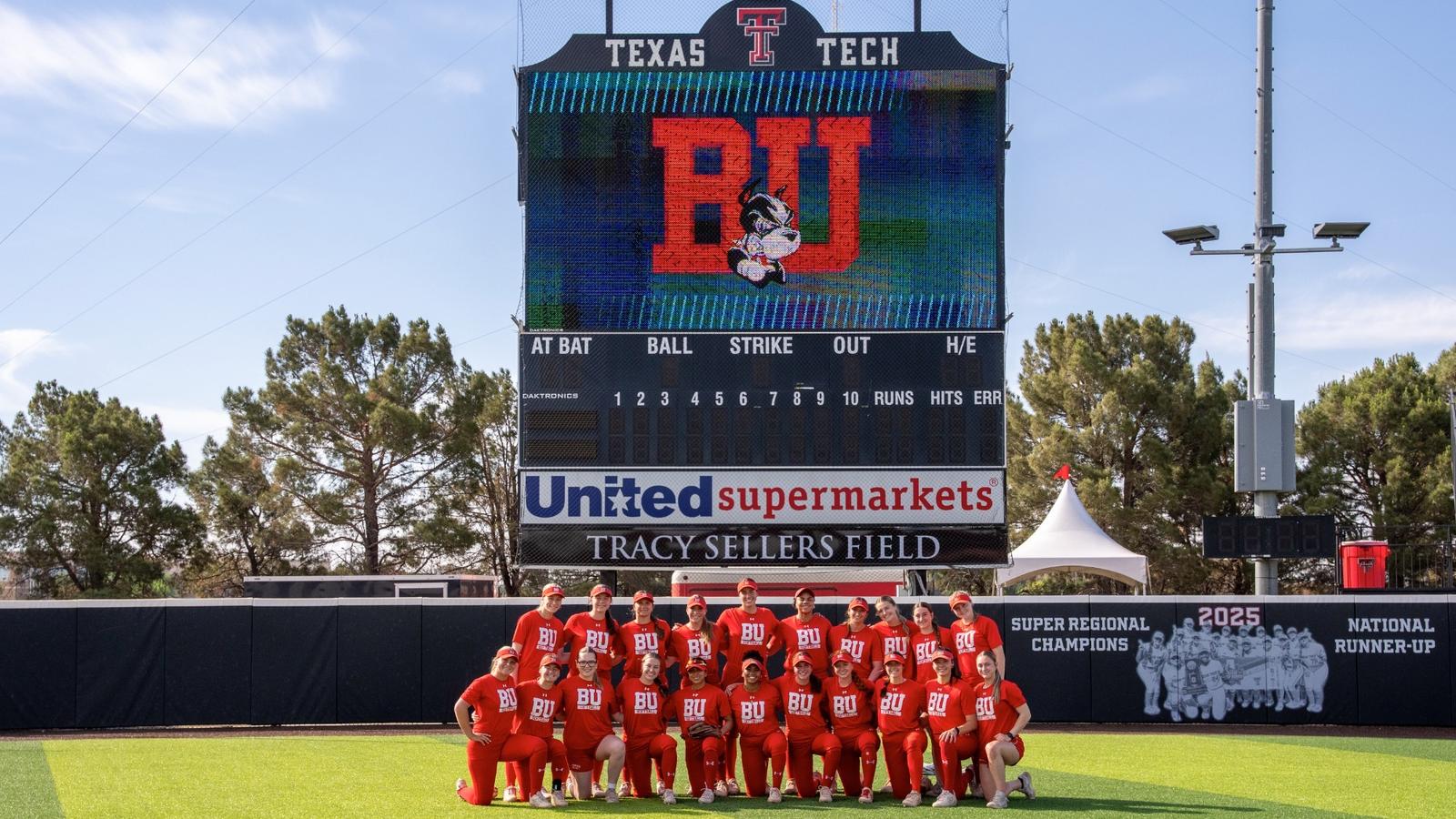 Boston University softball team jumps up in celebration after hearing their name called during the NCAA selection show on ESPN2