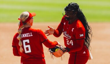 Kaitlyn Terry, Taylor Pannell and Jackie Lis celebrating at home plate after a home run