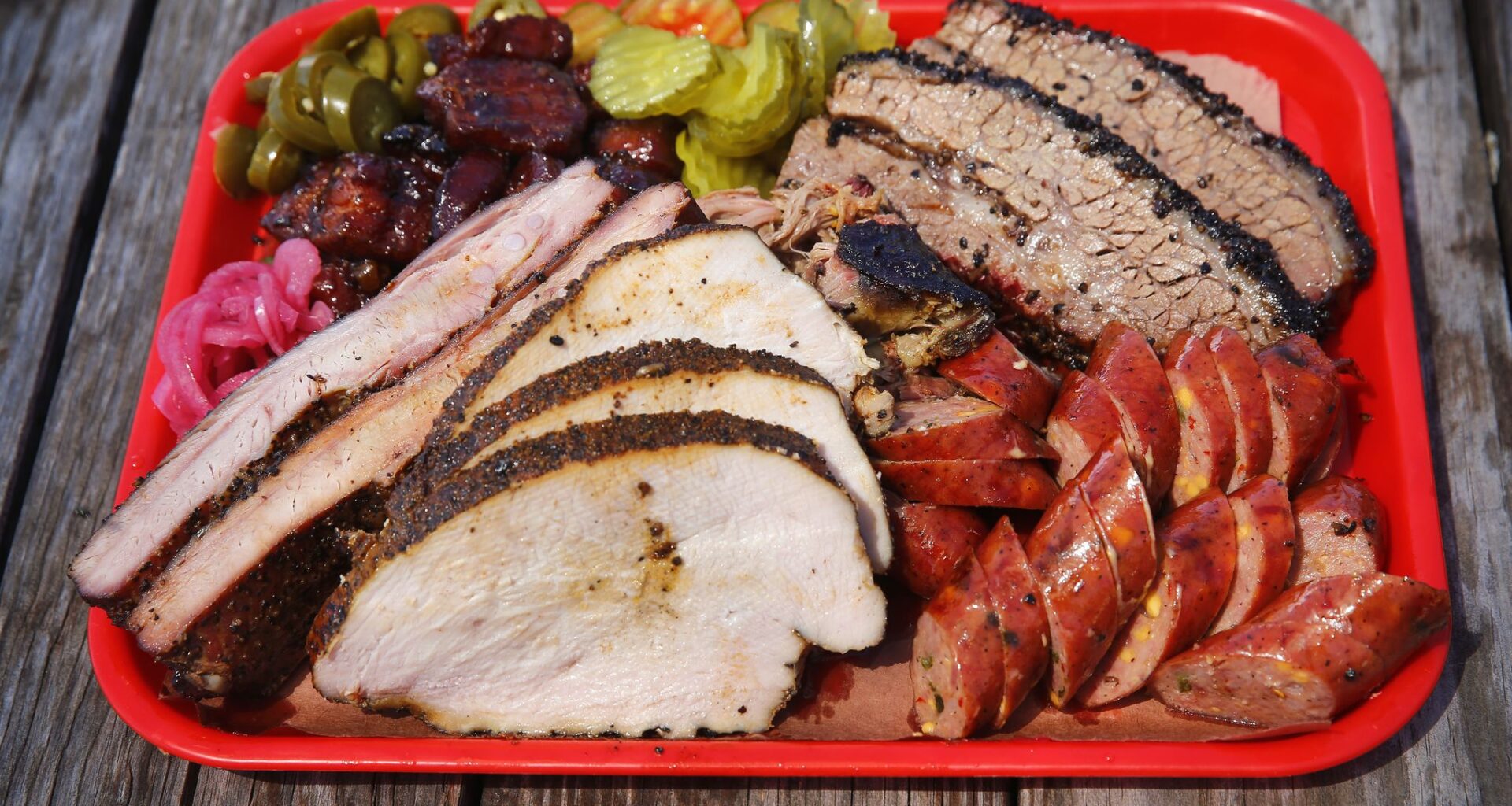 Panther City BBQ serves Hell's Half Acre, a tray full of brisket, pulled pork, sausage, pork ribs, smoked turkey and pork belly. The portions are a 1/2 pound on Hattie St. in Fort Worth, Saturday, April 19, 2019. (Tom Fox/The Dallas Morning News)