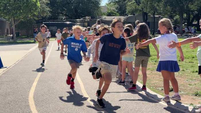 Woodridge Elementary School students cross finish line on full marathon journey