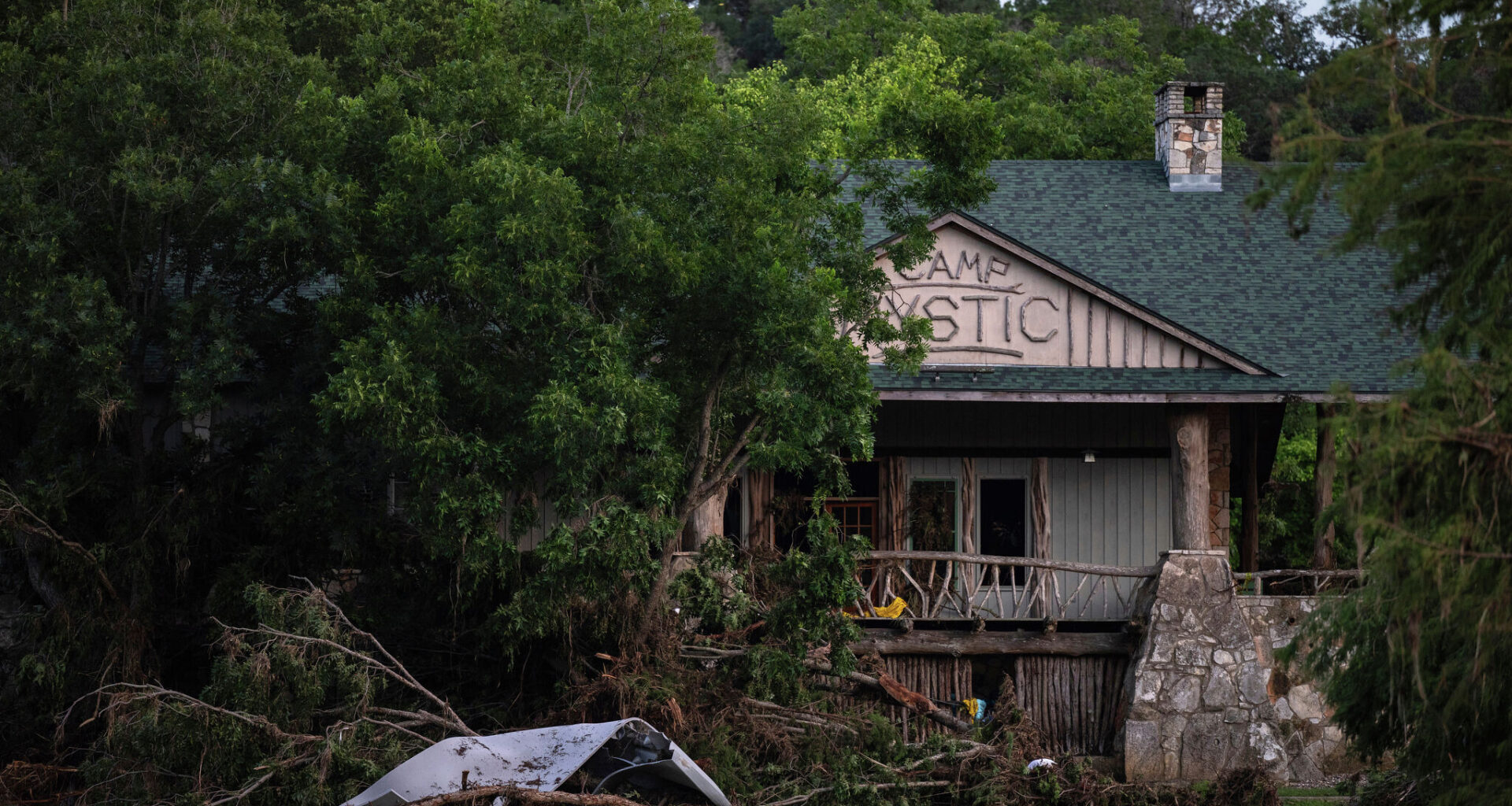 FILE - Debris covers the area of Camp Mystic in Hunt, Texas, July 7, 2025, after a flash flood swept through the area. (AP Photo/Eli Hartman, File)