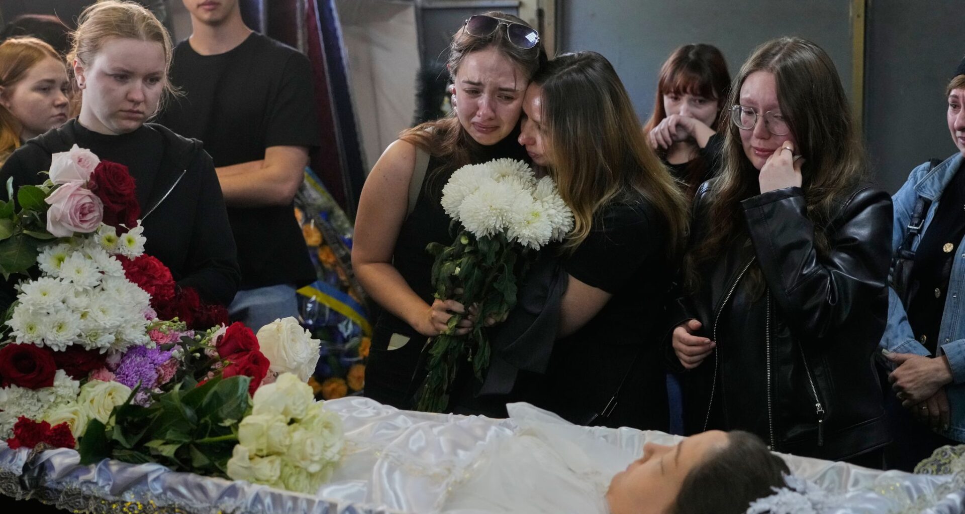 Young Kyiv couple killed in a fierce Russian airstrike hoped to start a family, mourners say