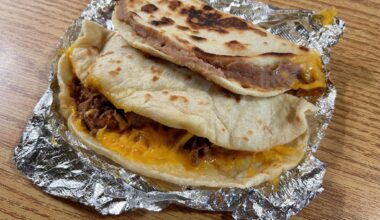 Toasted bean and cheese with bacon and carne guisada tacos from Original Donut Shop.