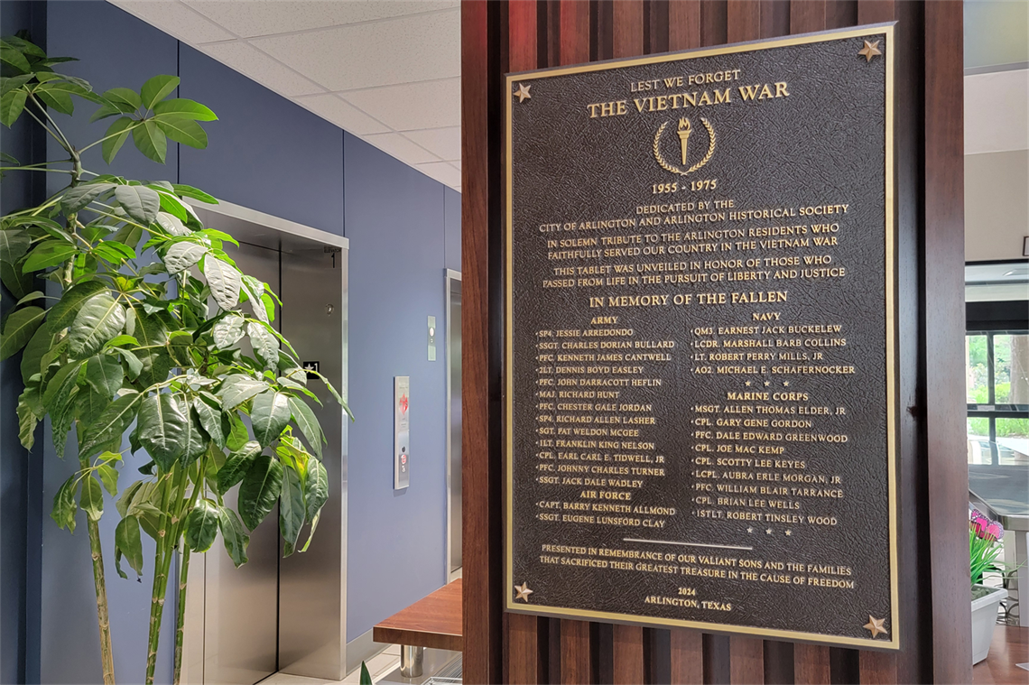 Plaque with names of veterans mounted on a wall