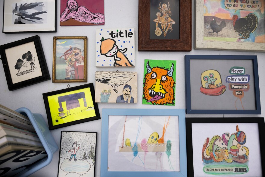 Pieces of artwork sit on a table for taking at Collection Rert in Austin, Texas, on May 16, 2026. Lorianne Willett/KUT News
