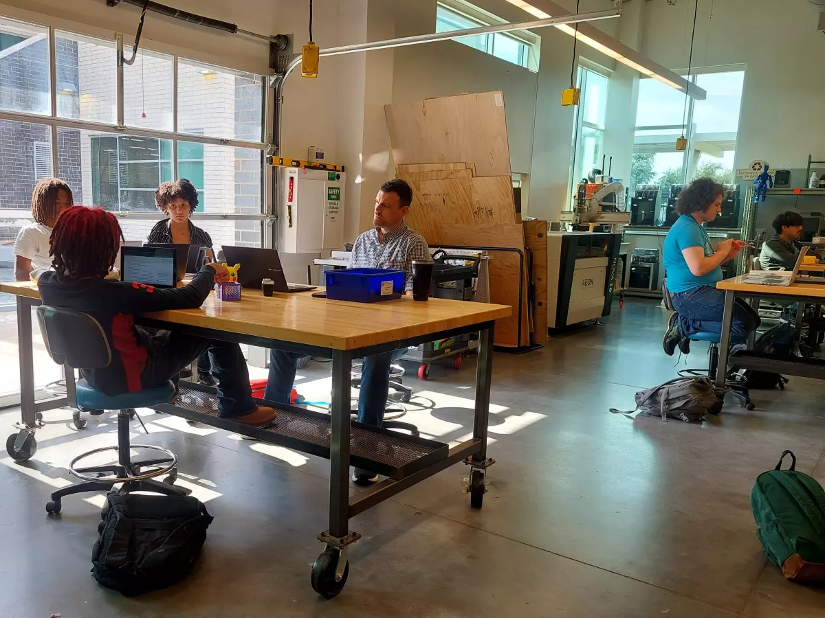 A group of students at Energy Institute High School work on a group project in teacher Calvin Mark's senior capstone class.