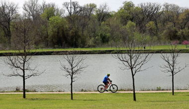 A man rides a bike in Oak Point Park and Nature Preserve, Tuesday, March 25, 2025, in Plano.