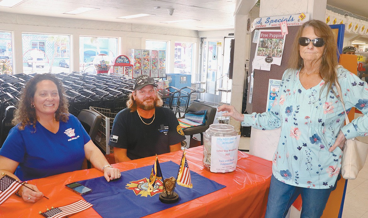Members of Moore McDonald VFW Post 8967 and Auxiliary to the Post held a fundraiser Labor Day weekend 2025 at Lowe’s Market. Post and auxiliary members will have a table set up in the Lowe’s lobby on Memorial Day weekend. They will collect donations and hand out flags. Above, from left are Ashley Thompson, auxiliary president, her husband Kenneth and Mary Ann Kelly, all of Port Aransas. South Jetty photo