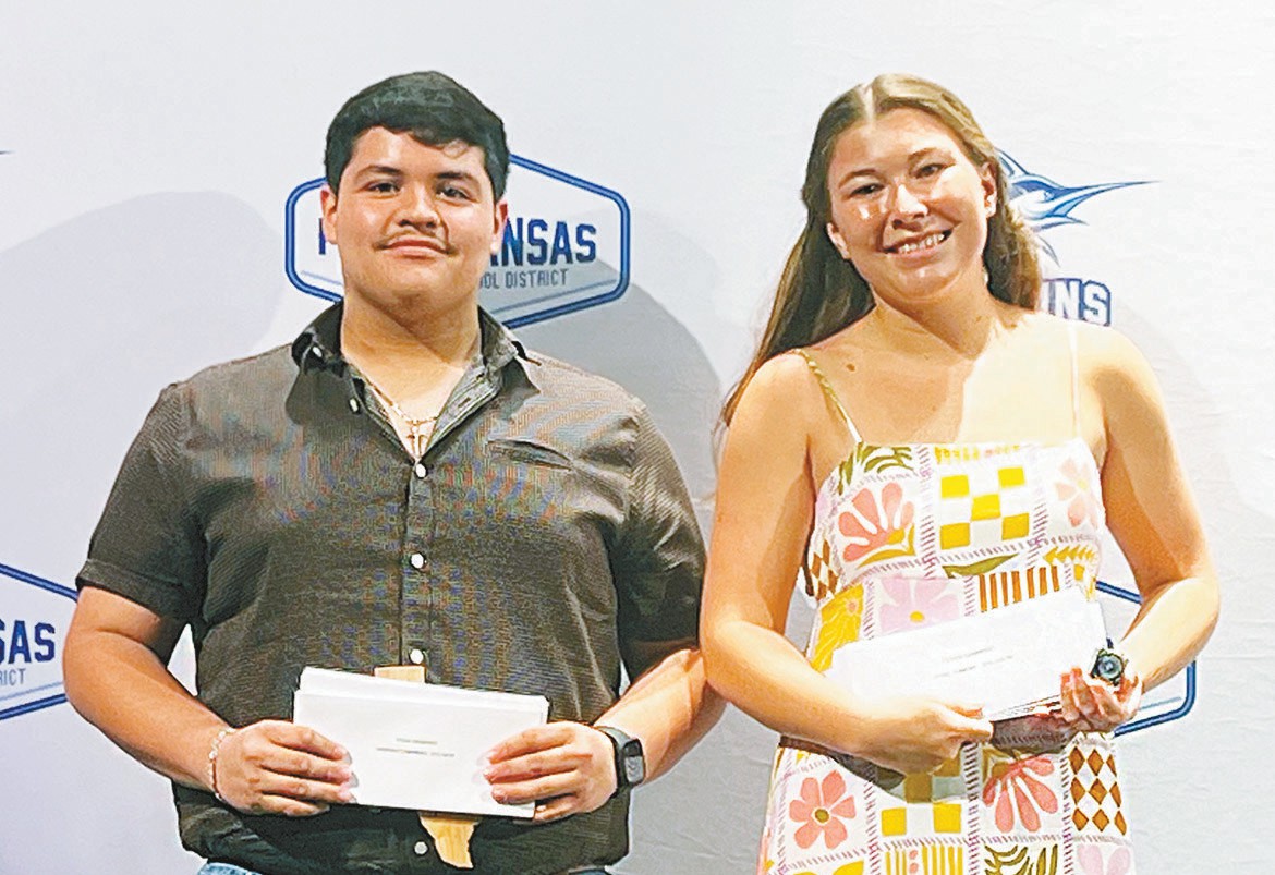 Valedictorian, salutatorian Port Aransas High School valedictorian Rodrigo Camarena, left, and salutatorian Sybil Gilmore hold the dozens of scholarship checks they received during the annual PAHS Scholarship Ceremony at the Jim and Judy Cole Performing Arts Center on Thursday, May 14. Staff photo by Jimmy Willden