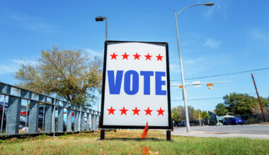 A "VOTE" sign is posted near a polling center in Austin. Texans head to the polls Tuesday to decide races for the Senate and other statewide and local offices. 
