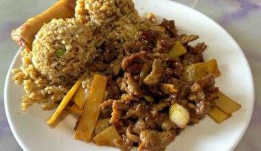Sichuan beef with fried rice and an egg roll from Gin Chinese Restaurant.