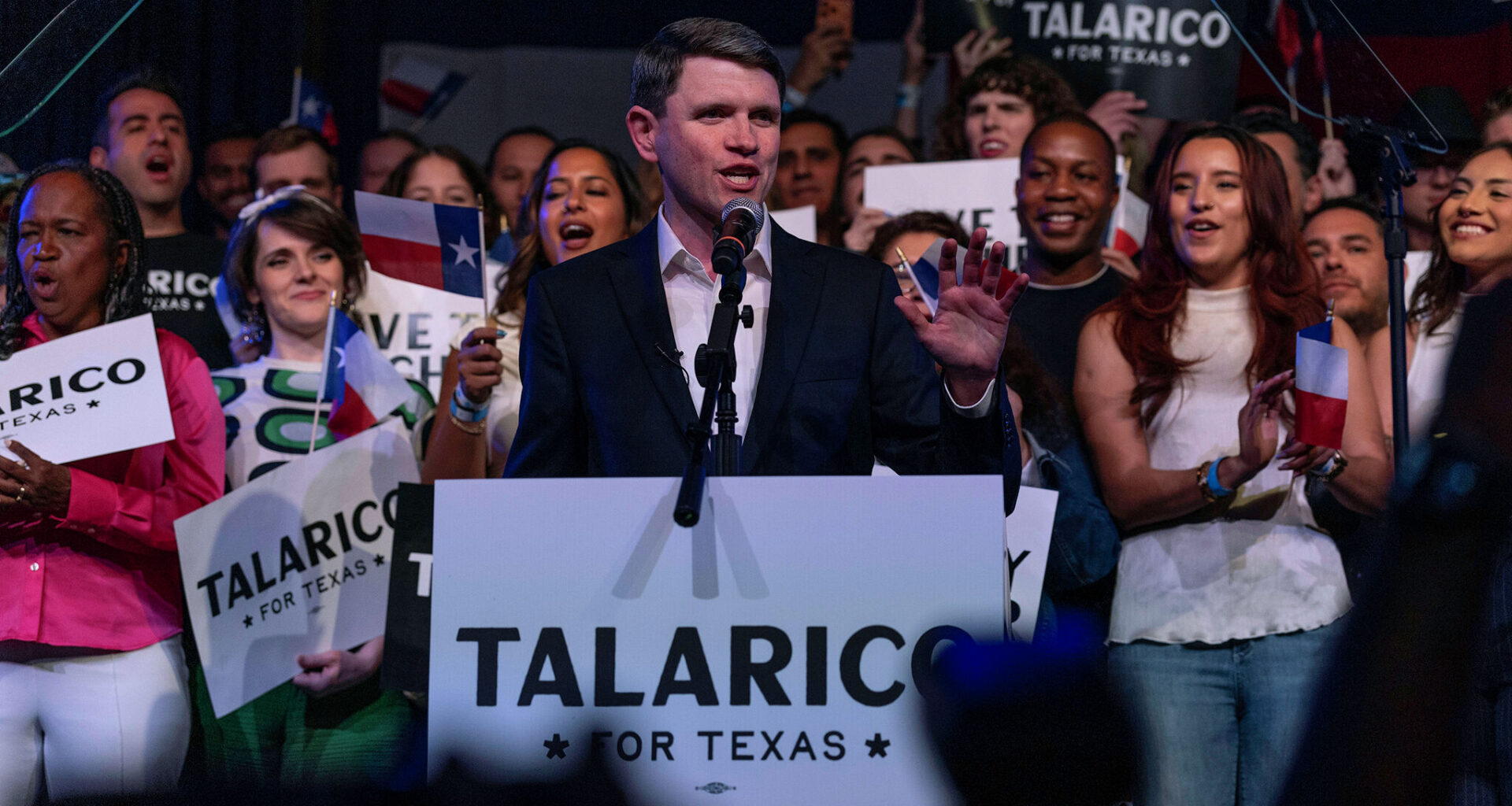 Michael Sorrell, (left) president of Paul Quinn College, shakes hand with Democratic Senate nominee James Talarico after he delivered the college's commencement address May 2 in Dallas.