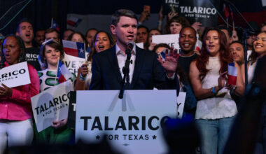 Michael Sorrell, (left) president of Paul Quinn College, shakes hand with Democratic Senate nominee James Talarico after he delivered the college's commencement address May 2 in Dallas.