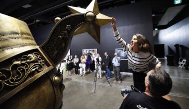 Arlington councilwoman Brittney Garcia-Dumas gives the Lone Star spur a spin after it was welded into place during an VIP unveiling at the Arlington Museum of Art, May 26, 2026. In advance of the FIFA World Cup, artist Steve Ekpenesi of Lagos, Nigeria created the ‘Texan Golden Boot" sculpture, a public art landmark to be erected in the Arlington Entertainment District.