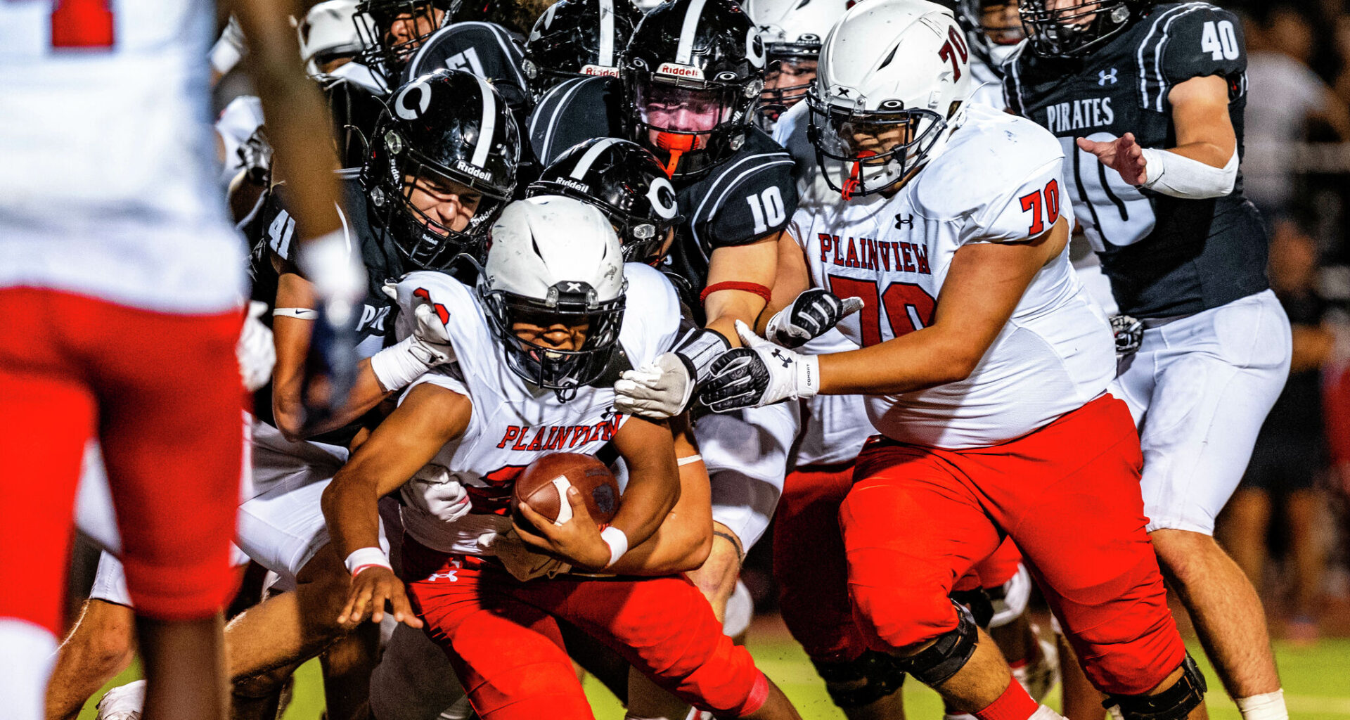 Running back Blaze Chambers gets tackled by a Lubbock-Cooper defender Sept. 26.