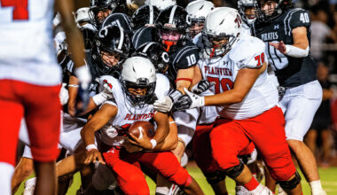 Running back Blaze Chambers gets tackled by a Lubbock-Cooper defender Sept. 26.
