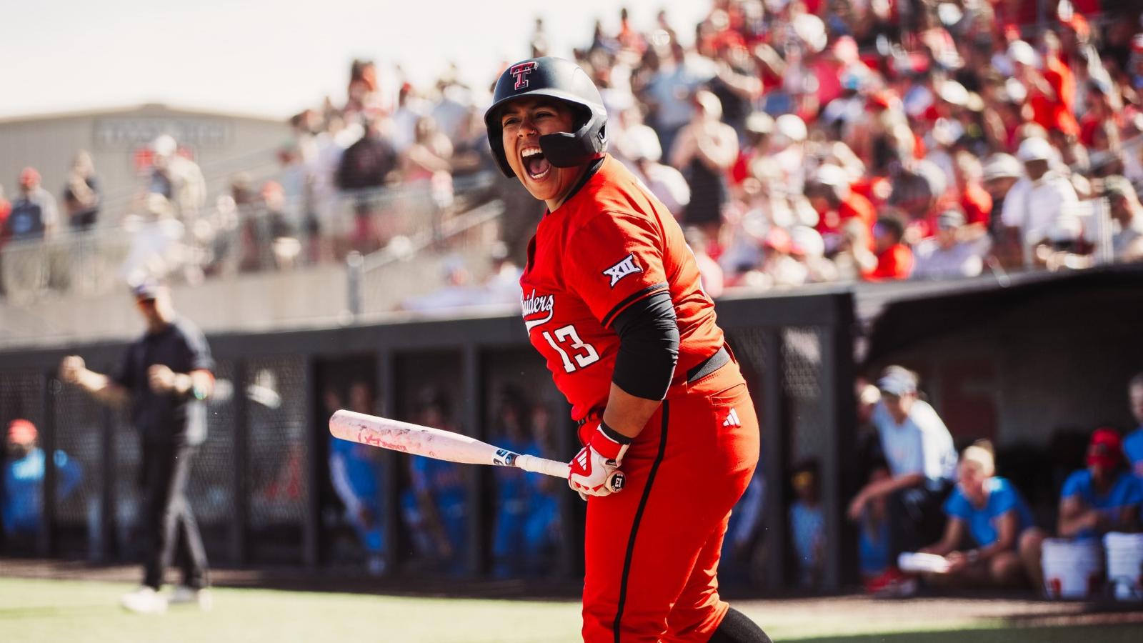 Taylor Pannell slides in safely to score a run against Tennessee at the WCWS.