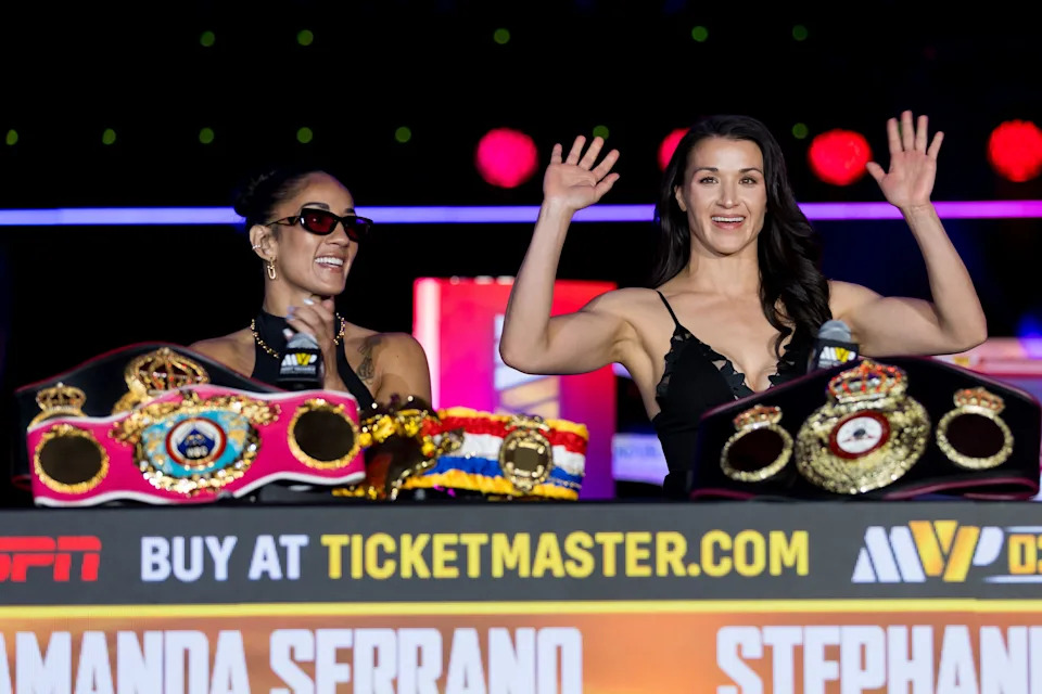 Puerto Rican boxer Amanda Serrano sits next to El Paso boxer Stephanie Han as Han is introduced during a news conference Thursday, May 28, 2026, at El Paso County Coliseum before her fight against Holly Holm on the MVPW-03 card.