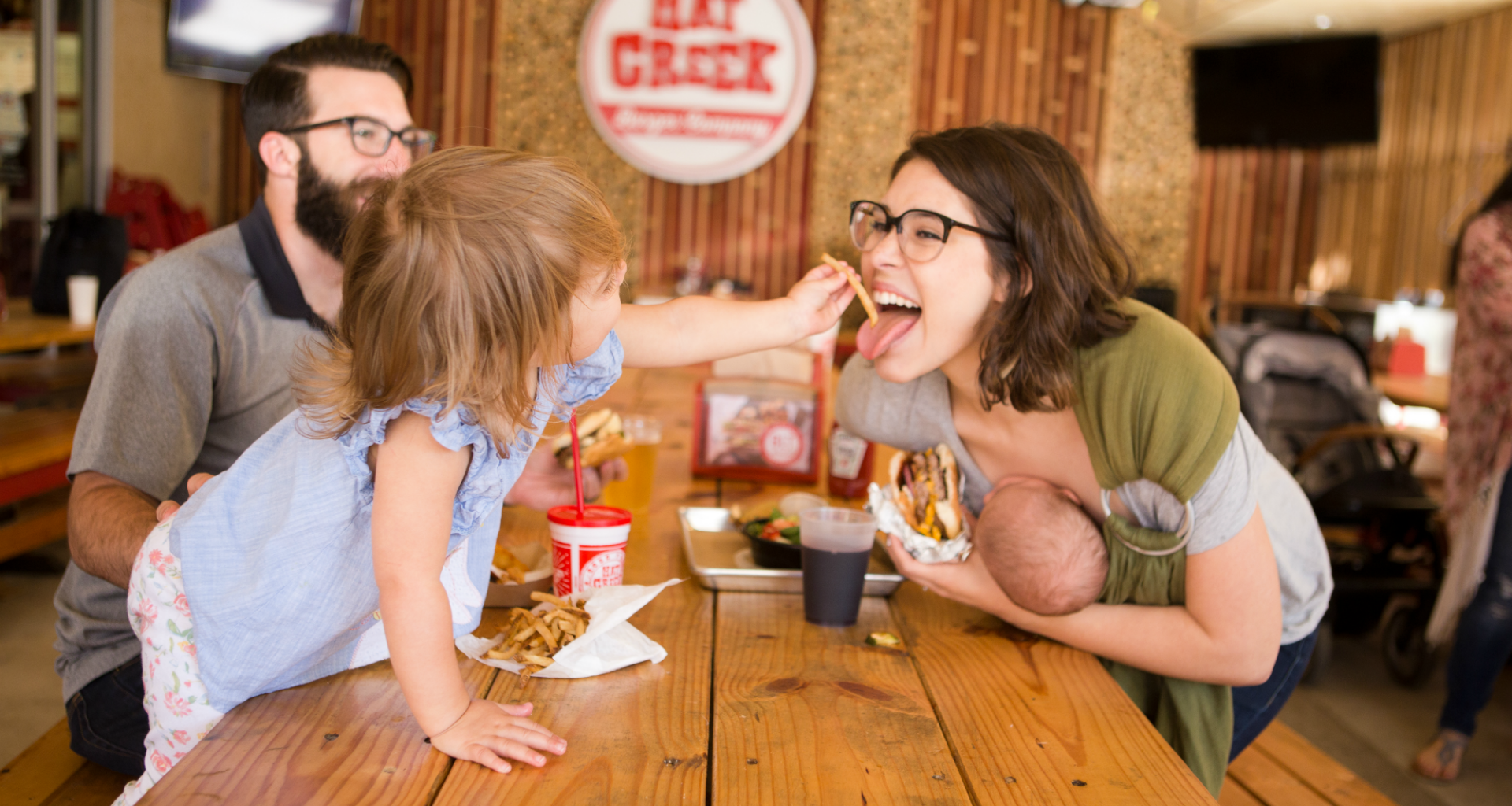 Family enjoying a meal together at a restaurant
