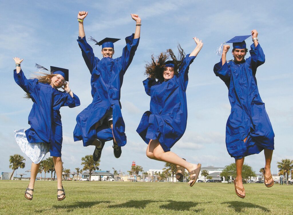 Jumping for joy are, from left, Port Aransas High School seniors Caitlyn Boyer, Tyler Hofhiens, Brooke Jones and Cohen Guevara. They are among 51 seniors who will take part in graduation ceremonies on Thursday, May 21. Staff photo by Dan Parker