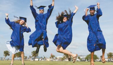 Jumping for joy are, from left, Port Aransas High School seniors Caitlyn Boyer, Tyler Hofhiens, Brooke Jones and Cohen Guevara. They are among 51 seniors who will take part in graduation ceremonies on Thursday, May 21. Staff photo by Dan Parker