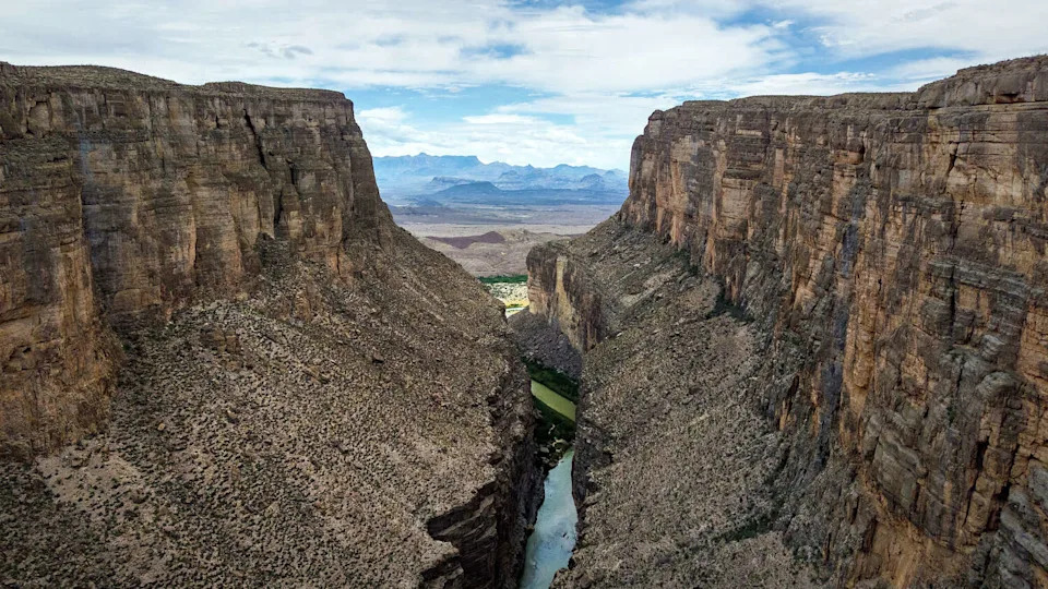 BIG BEND NATIONAL PARK, TEXAS - APRIL 11: From an aerial view, the Rio Grande flows through the Santa Elena Canon on April 11, 2026 in Big Bend National Park, Texas. The U.S.-Mexico border is demarcated in the center of the river. Trump Administration plans to extend the U.S.-Mexico border wall into the region have sparked rare bi-partisan unity among Texans against construction through one of the most rugged and pristine parts of the United States. Critics of the construction say there is no need for a wall there, citing the low number of immigrants who attempt to cross through the forbidding terrain. (Photo by John Moore/Getty Images) (John Moore/Getty Images)