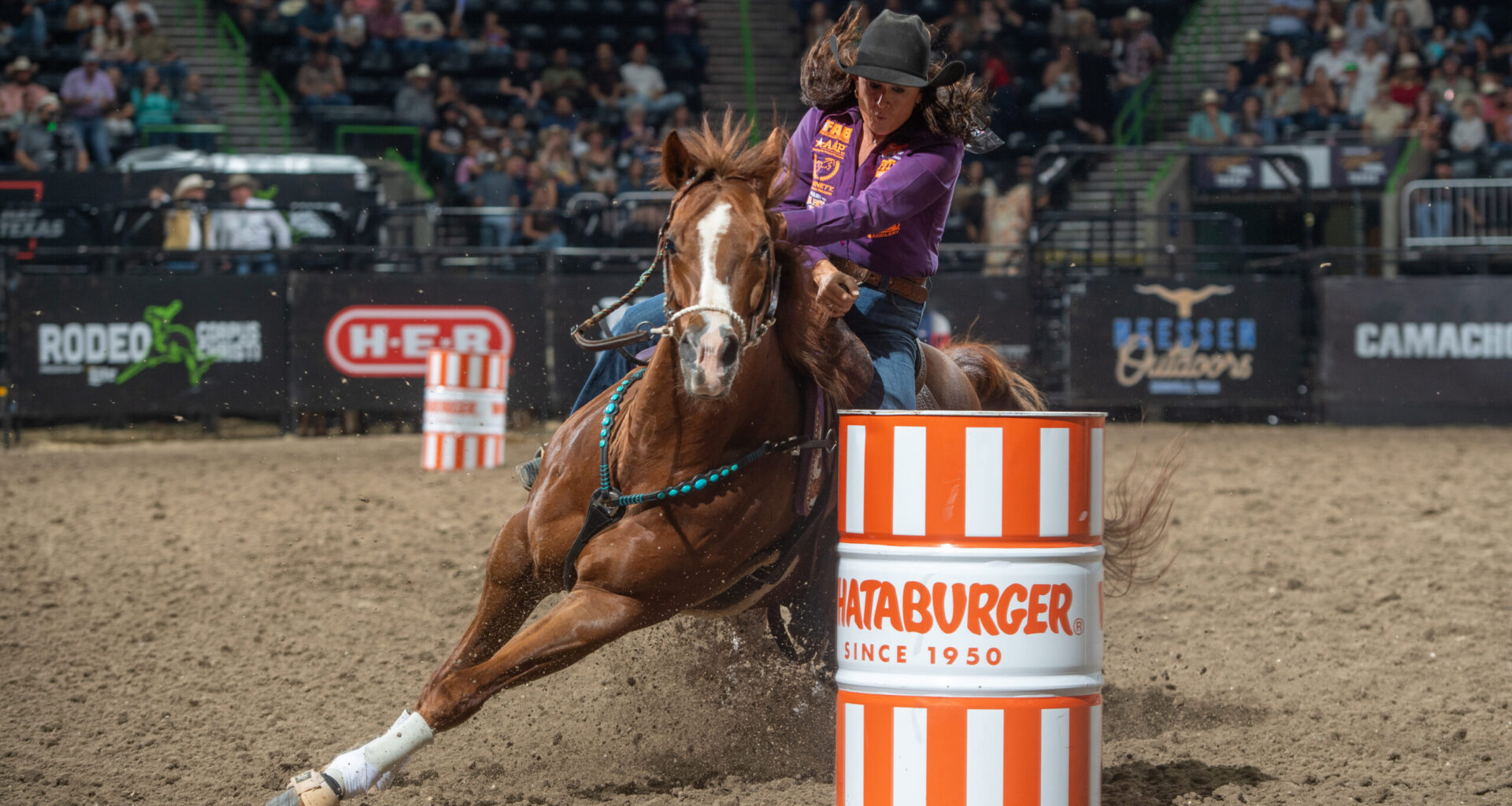 Stephanie Fryar turns a barrel on her horse