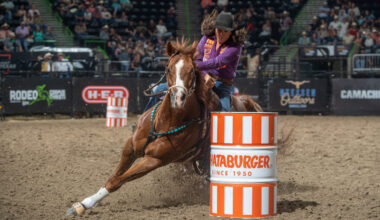 Stephanie Fryar turns a barrel on her horse
