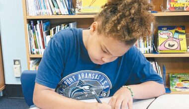 H.G. Olsen Elementary School fourth-grader Kamilla Jenkins works on a poem in the school library on Tuesday, May 19. Staff photo by Jimmy Willden