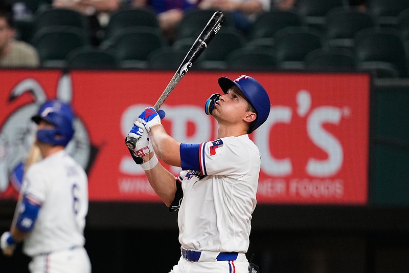 Texas Rangers' Corey Seager watches his fly out to left in the fourth inning of a baseball game against the Arizona Diamondbacks Monday, May 11, 2026, in Arlington, Texas. (AP Photo/Tony Gutierrez)