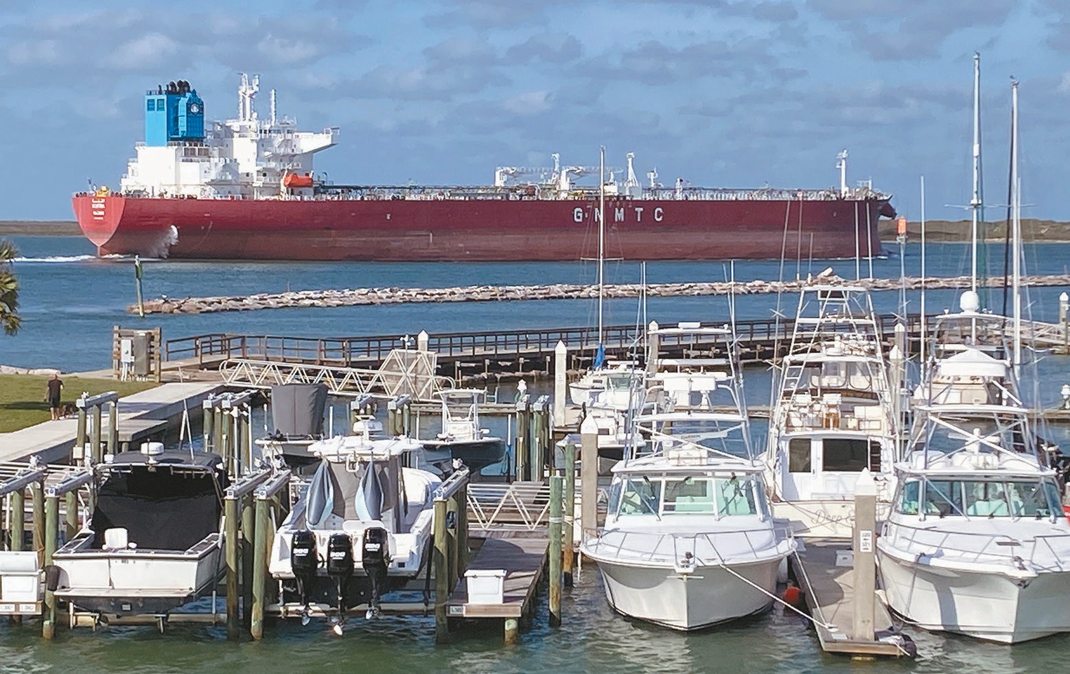 A tanker ship passes Dennis Dreyer Municipal Harbor in Port Aransas on a recent day. Folks using the boat ramps in the harbor should watch for passing ships because they can cause water levels at the ramps to fluctuate, creating safety concerns. Staff photo by Dan Parker