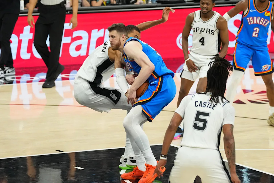 May 24, 2026; San Antonio, Texas, USA; Oklahoma City Thunder center Isaiah Hartenstein (55) drives against San Antonio Spurs center Victor Wembanyama (1) in the second quarter during game four of the western conference finals for the 2026 NBA playoffs at Frost Bank Center. Mandatory Credit: Scott Wachter-Imagn Images